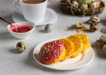 Carrot cake or traditional Orthodox Easter sweet bread with carrot covered pink glaze. Carrot Kulich  decorated with pink glaze.