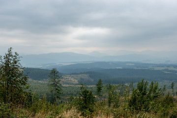 cloudy and foggy sunrise over slovakian landscape in autumn