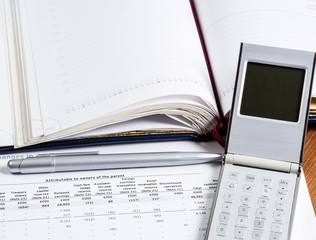 Business analytics Calculator and financial documents