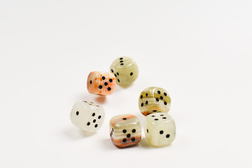 Dices made of natural stone on a white background. Copy space. Gaming.