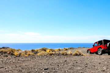 Red summer car and sea landscape 