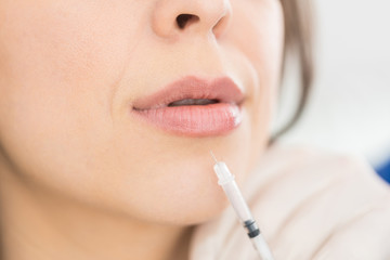 Woman's Lips Receiving Beauty Injection