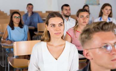 Fototapeta premium Woman listening to lecture