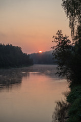 Fototapeta na wymiar colorful sunset on the river
