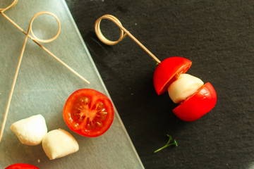 Mozzarella and tomato canapes salad - caprese. food background. top image