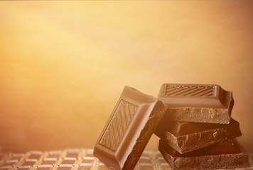 Delicious chocolates isolated on background