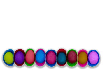 Row of easter eggs isolated on white