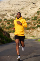 healthy african american man running on street