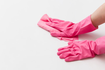 Detergents and cleaning accessories. Hand in a protective glove with a washing sponge. Cleaning service concept