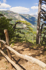 Mountain landscape with a wooden fence,limiting the Hiking trail.Crimea.