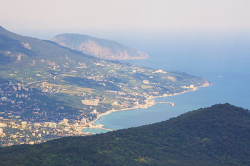 Fototapeta na wymiar Black sea coast,mountains and the city with a bird's flight.Crimea.