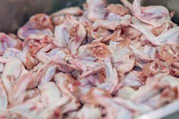 Cut chicken wings in production