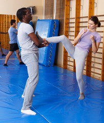 People practicing self defense techniques