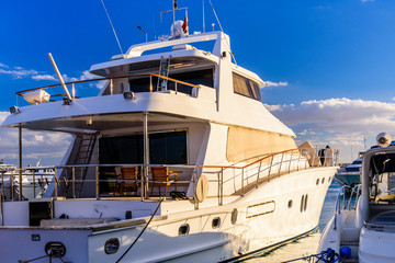 White luxury yacht in a sea harbor of Hurghada, Egypt. Marina with tourist boats on Red Sea