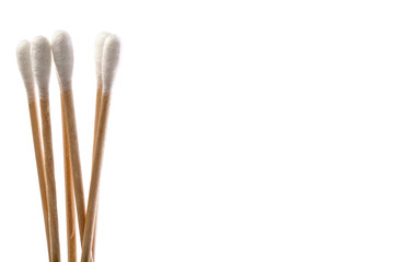 Eco-friendly materials. Wooden, cotton swabs on a white background.