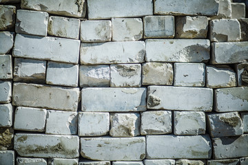 Pallet of paving slab closeup on a construction site in sunny day. Paving slabs in the packaging at the construction site. Brick. Close-up.
