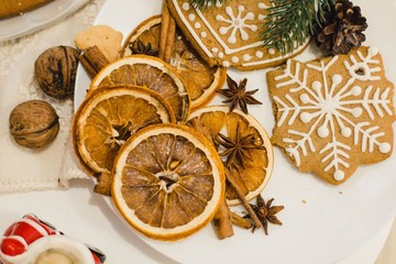 home made christmas ginger cookies and decoration from oranges