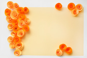 Colorful handmade paper flowers on light coloured background for invitation and wedding
