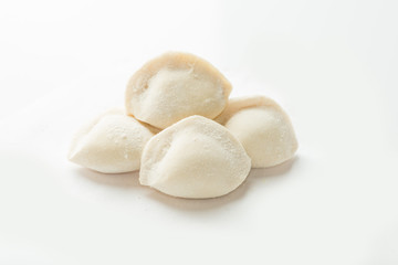 four frozen dumplings on a white background. Isolated Dumplings