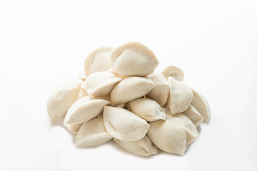 heap of frozen dumplings on a white background. Isolated Dumplings