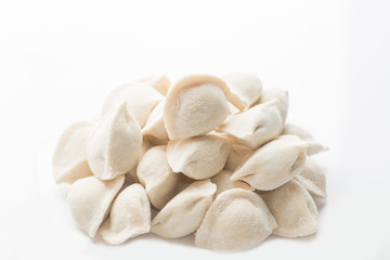 heap of frozen dumplings on a white background. Isolated Dumplings