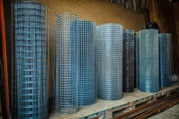 Rolls of iron mesh (wire mesh) use for reinforce concrete in construction site. Metal grid. Grid of...