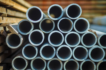 Asbestos Concrete Pipe Stacked For use in construction. In the drainage or water supply section. Stack of pipes. Sewage Drainage Concrete Pipeline, Materials for construction at work on concrete roads