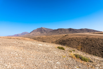 Panoramic view desert region  Playa Blanca Papagayo - White Beach Papagayo, - at volcanic island Lanzarote, Canary Islands, Spain.  Travel vacation concept.