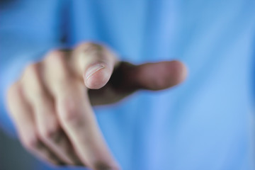 Obraz premium Hand pushing on a touch screen.