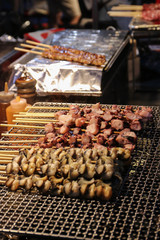 The meat of octopus and tiny ones is fried on a lattice. Asian f
