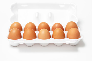 eggs in a tray on a white background