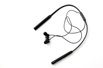 Black headphones on white background. Listen to music. Audio equipment concept.