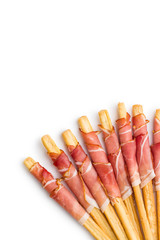Parma ham prosciutto with grissini breadsticks.