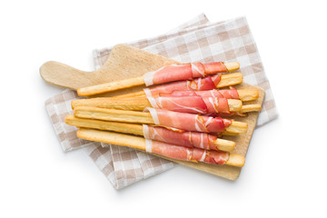 Parma ham prosciutto with grissini breadsticks.