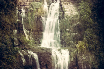 Fototapeta na wymiar Vintage waterfall scenery landscape Ramboda falls in Sri Lanka Nawara Eliya 