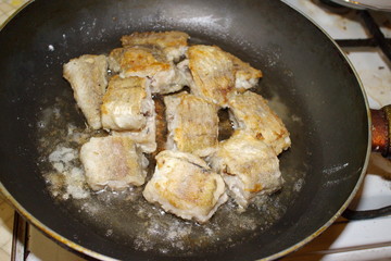 fried fish cooking in a pan