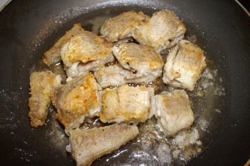 fried fish cooking in a pan