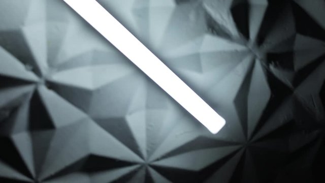 Adventure inside the empty corridor. Close-up of the bright lamps on the ceiling in a strange place.