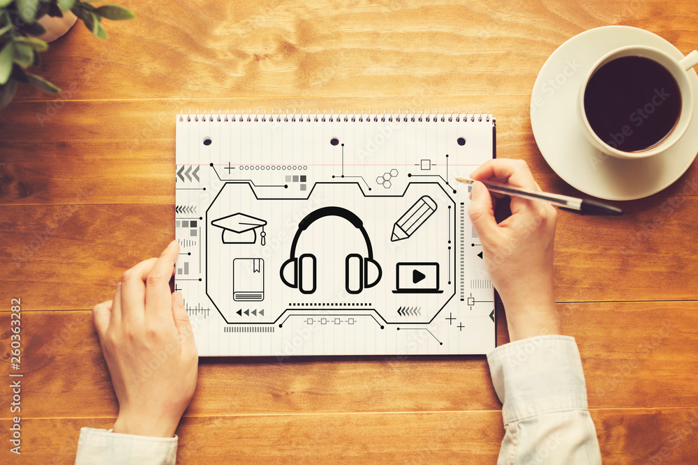 Poster e-learning concept with a person writing in a notebook on a wooden table