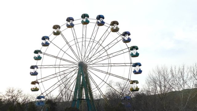 fixed ferris wheel on sky background frozen in time
