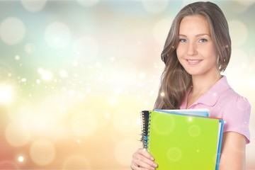 Fototapeta premium Portrait of young cute woman student on background