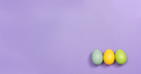 Decorated Easter eggs holiday theme on a purple background