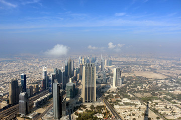 Fototapeta na wymiar Aerial view of Dubai Skyline, Amazing Rooftop view of Dubai Sheikh Zayed Road Residential and Business Skyscrapers in Downtown Dubai, United Arab Emirates