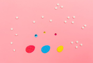 Little Easter decorations on a pink background