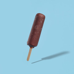 chocolate covered popsicle ice cream on a blue background