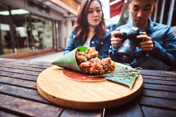Young asian couple enjoy chinese food at cafe