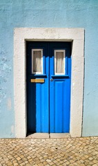 Old and colorful wooden door with iron details