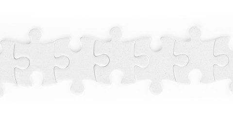 White jigsaw puzzle pieces row isolated with clipping path