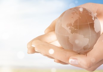 Environment concept, glass globe and green leaf