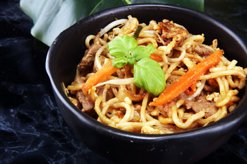 Assorted Chinese food set. Chinese noodles, fried rice, peking duck, dim sum, spring rolls. Famous Chinese cuisine dishes on table. Chinese restaurant